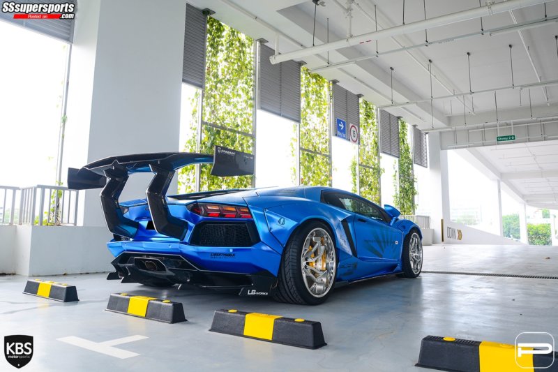 2-chrome-blue-liberty-walk-lamborghini-aventador-pur-wheels-rear-side-view-huge-wing