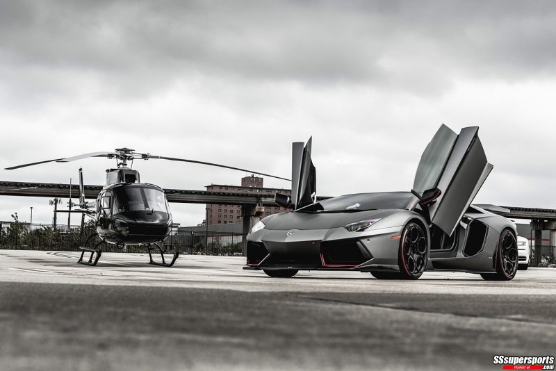 1-frozen-gray-dmc-lamborghini-aventador-roadster-on-adv1-wheels-and-helicopter